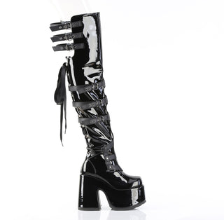 Side view of Demonia Camel-308 black patent thigh-high boots with platform heel, back lacing, and buckle straps