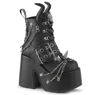 Demonia Camel‑64 black platform ankle boot with chunky heel, devil horns, claw spikes, and barbed wire chain details, on a white background.