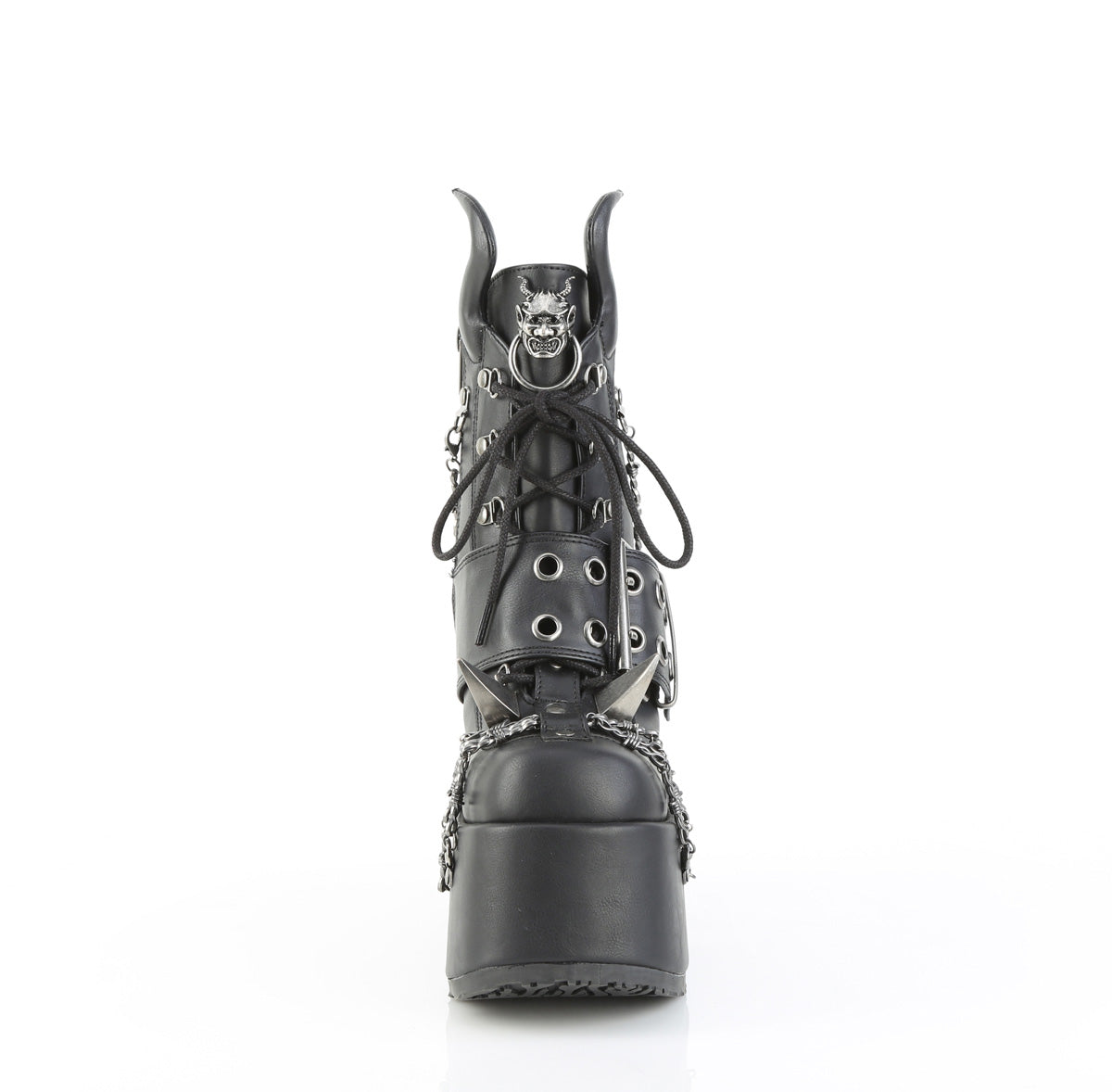 Front view of Demonia Camel‑64 black platform ankle boot with chunky heel, devil horns, claw spikes, barbed wire chain, and metal devil emblem, on a white background.