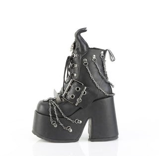 Demonia Camel‑64 black platform ankle boot, outer side view, with chunky heel, devil horns, claw spikes, and barbed wire chain details, on a white background.