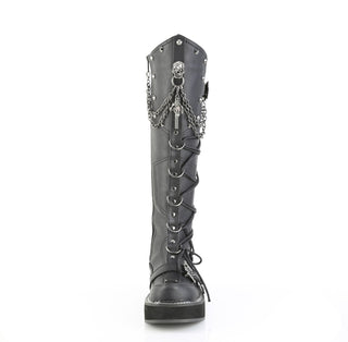 Front view of Demonia Emily-221 black knee-high platform boot with skull buckle and chain details on white background