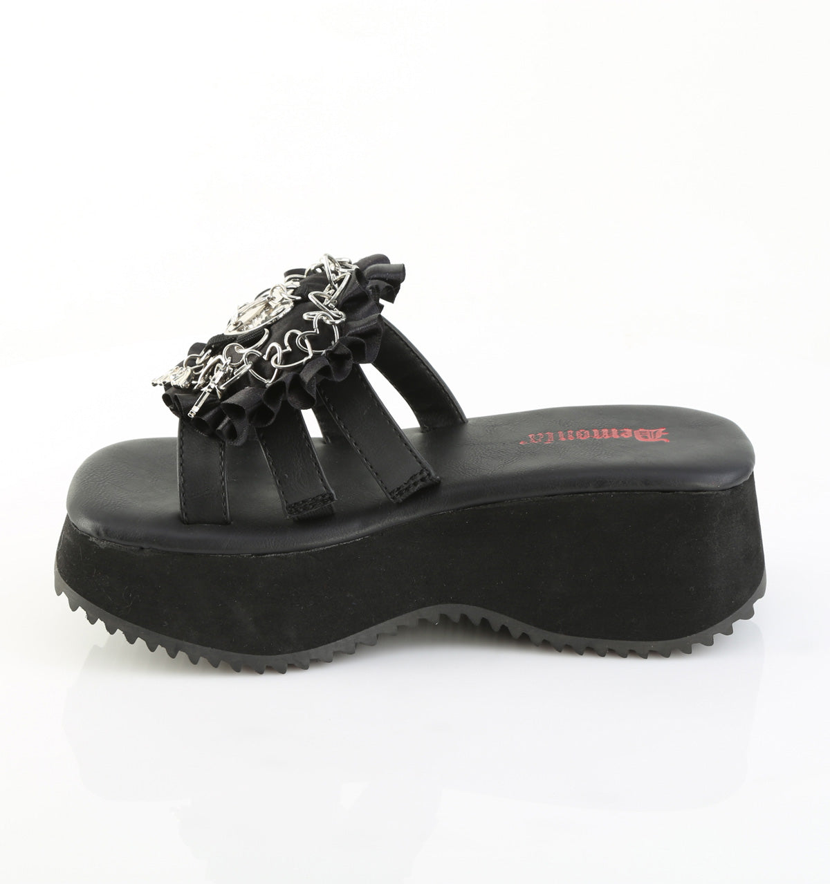 Side view of black Demonia flip-16 platform sandal with ruffled strap, silver gothic charms, and triple black straps over a chunky wedge sole.