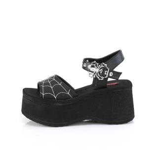 Outer side of Demonia FUNN-10 sandals featuring silver-tone spider-shaped buckle and platform sole