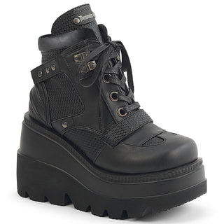 Black wedge platform ankle boots with mixed textured panels, lace-up front, padded collar, and chunky tread sole