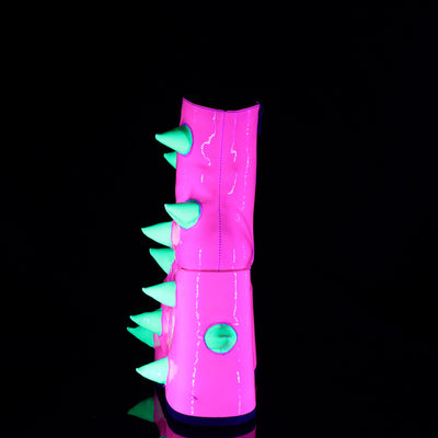 Back view of the Demonia Slay-77 neon pink platform boot with vertical row of soft green spikes and glossy UV-reactive finish, shown under blacklight.