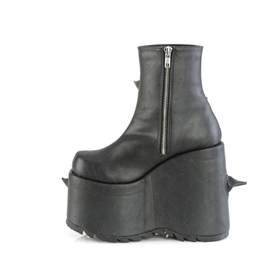 Inner side view of the Demonia Slay-77 black pu boot with side zipper and curved black spikes on a high platform wedge