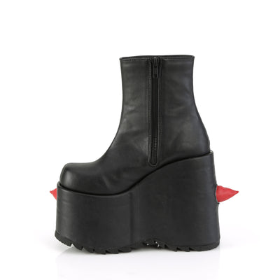 Inner side view of the Demonia Slay-77 black platform boot with red spikes, featuring a visible zipper and sculpted wedge sole.
