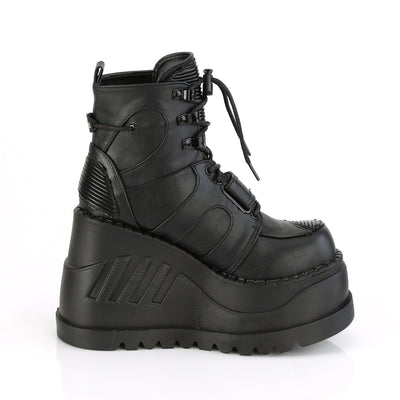 Demonia Stomp-13 black wedge platform ankle boot with lace-up front and quilted panels, side view on white background.