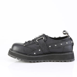 Side view of Demonia Valor-38 showing black vegan leather and platform sole