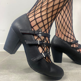 Close-up of Demonia Vivika-38 black multi-strap Mary Jane heels with fishnet tights