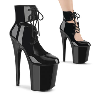 Black patent lace-up cutout platform booties with 8-inch stiletto heels and closed toe design
