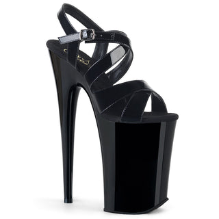Pleaser Infinity-997 black 9-inch platform stiletto sandals with glossy patent straps and ankle buckle.
