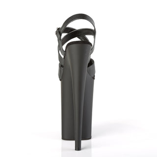 Back view of black 9-inch platform sandal with criss-cross straps on white background.