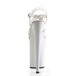 White 9-inch platform heel sandal, rear view, with ankle strap and stiletto heel.