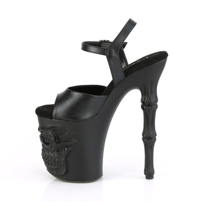 Pleaser Rapture‑809 black PU pole sandal, inner side view, with skull‑sculpted platform and bone‑style stiletto heel, on a white background.