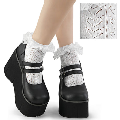 Black platform Mary Jane shoes with double buckle straps, worn with white frilled socks featuring a heart pattern.