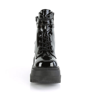Front view of Demonia Shaker-52 Black Patent boots with lace-up design