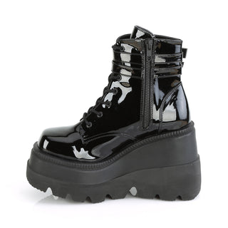 Inner side of Demonia Shaker-52 Black Patent boots featuring side zipper