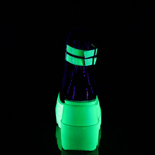 back side of demonia shaker-52 neon green glowing in the dark