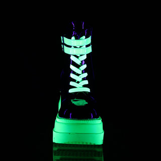 front view of demonia shaker-52 neon green glowing in the dark and showing laces