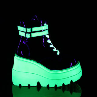 outer side of demonia shaker-52 neon green glowing in dark and showing side buckles