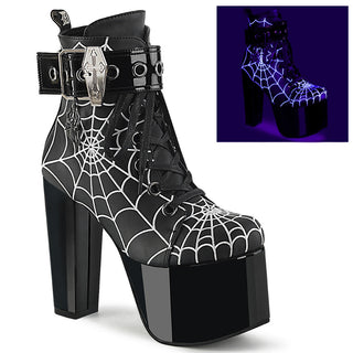Demonia Torment-51 black platform boots with spider web pattern, coffin buckle, and UV-reactive design, ideal for gothic looks, raves, and parties.