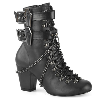 Black vegan Demonia Vivika-128 ankle boot with block heel, rounded toe, lace-up front, inner side zip, coffin buckle straps, and decorative chains.