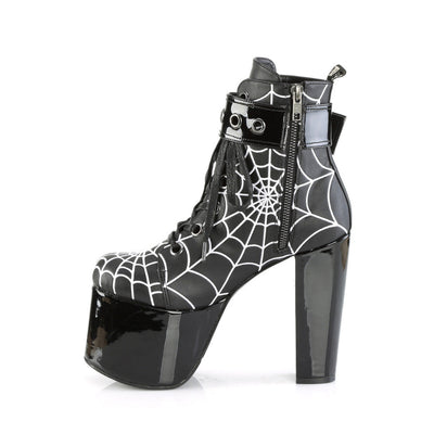 Inner side view of Demonia Torment-51 boots showing inner zipper, spiderweb print, and glossy black platform heel.